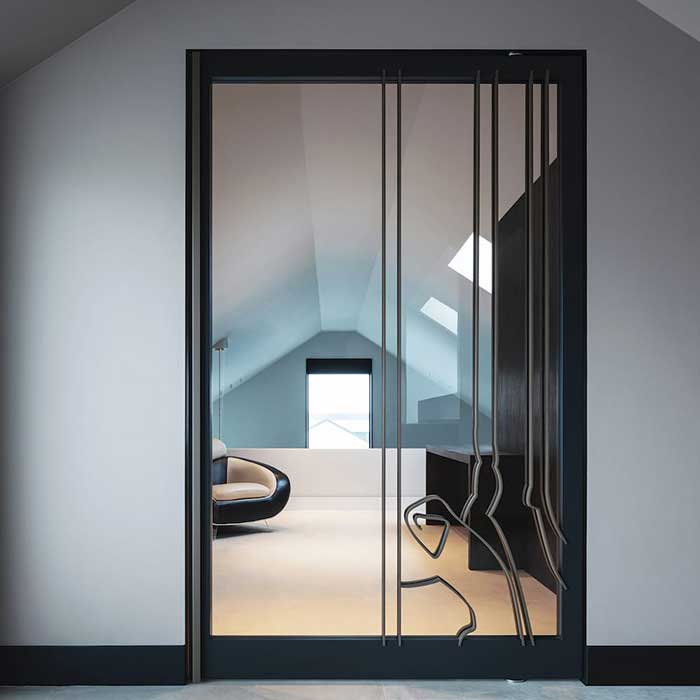 Pivot hinge glass door with door hardware from Bellevue Architectural